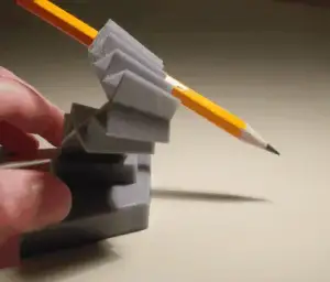 pencil stabilizing compliant mechanism