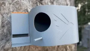 Modern birdhouse with a feeder