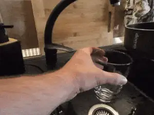 Clip-on strainer for pots, pans and bowls