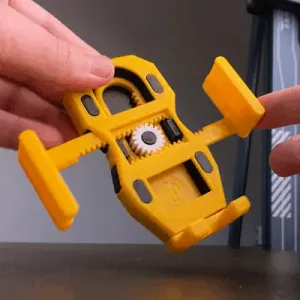 MECHANICAL MOBILE PHONE HOLDER WITH MINIMALIST GEAR
