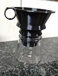 Wide mouth Funnel filing different sizes of glass bottles