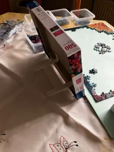 Simple practical puzzle lid stand / holder for a better view