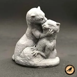 Two otters kiss
