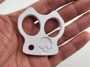 Mini skull duster brass knuckles