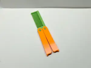 Butterfly knife folding comb
