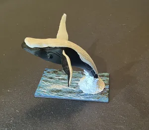 Humpback Whale Breaching the Ocean Surface