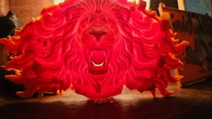 Lion Head Bursting Through the Wall