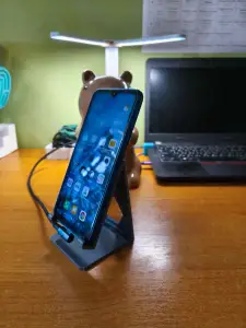 Phone stand for side charging cable