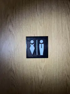 Toilet markings, stick figures on the toilet door