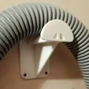 Vacuum cleaner hose storage holder