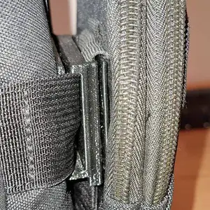 A buckle connecting two cross straps - a MOLLE-like holder
