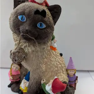 Cat Playing with Gnomes