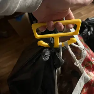 Holder, carrier for plastic bags or trash bag