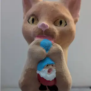Cat playing with Gnomes