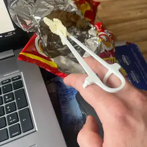 A device for eating chips, nachos, chopsticks for eating