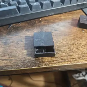 Small pill box with sliding lid