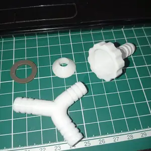 Faucet fitting with a tee