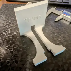 "The Stand" A simple phone stand with cord wrap on back.