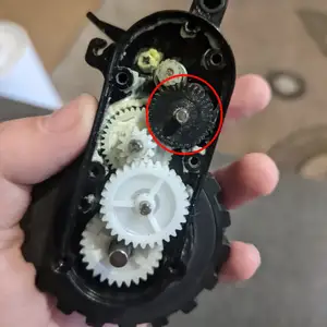 The gear wheel of the DEXP robot vacuum cleaner